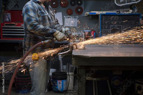 Midsection of man working in workshop