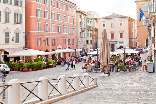 Fototapeta Naklejka Na Ścianę i Meble -  Ancona, Italy - June 8 2019: People enjoying summer day and food at outdoor restaurant and resting.
