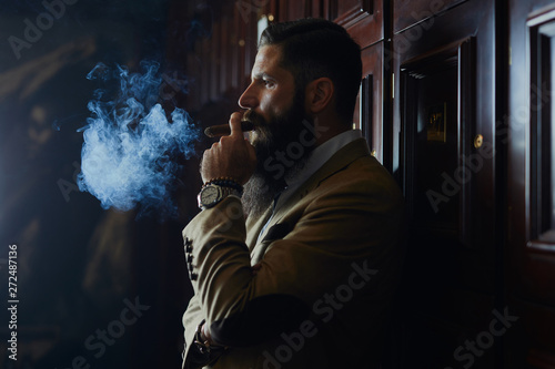 Handsome man with cigar. photo