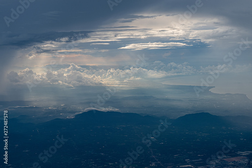 Clouds seen from an airplane  blue sunshine  soil background nature landscape