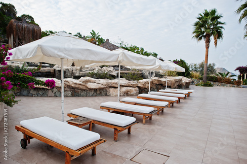 Sunbeds with umbrella at resort in Bodrum  Turkey.
