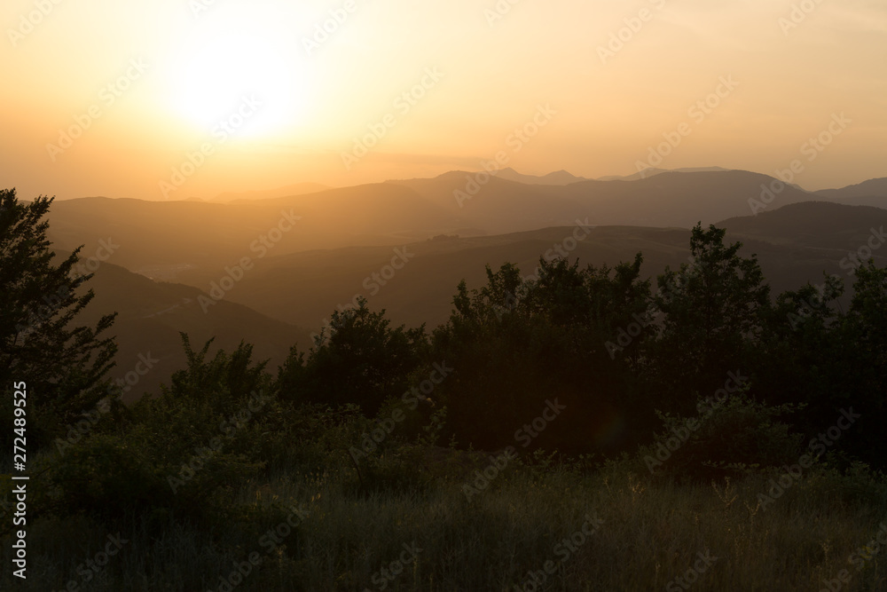 Beautiful landscape in the mountains with the sun at dawn. Mountains at the sunset time. Azerbaijan Caucasus Mountains. Agsu pass. Baskal. Nature Beautiful landscape in the mountains with the sun at dawn. Mountains at the sunset time. Azerbaijan Caucasus Mountains. Agsu pass. Baskal. Nature