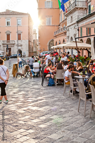 Fototapeta Naklejka Na Ścianę i Meble -  Ancona, Italy - June 8 2019: People enjoying summer day and food at outdoor restaurant and resting.