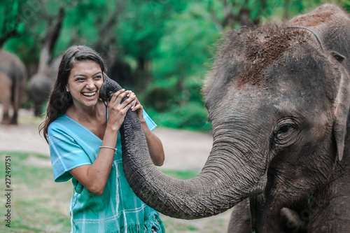 Photography Girl having fun with elephants at Patara Elephant Farm, Chiang Mai, Thailand