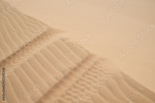 Abstract background of wind effect on dunes at desert.