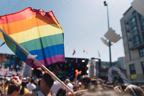 People With Rainbow Flags Attending a Gay pride photo