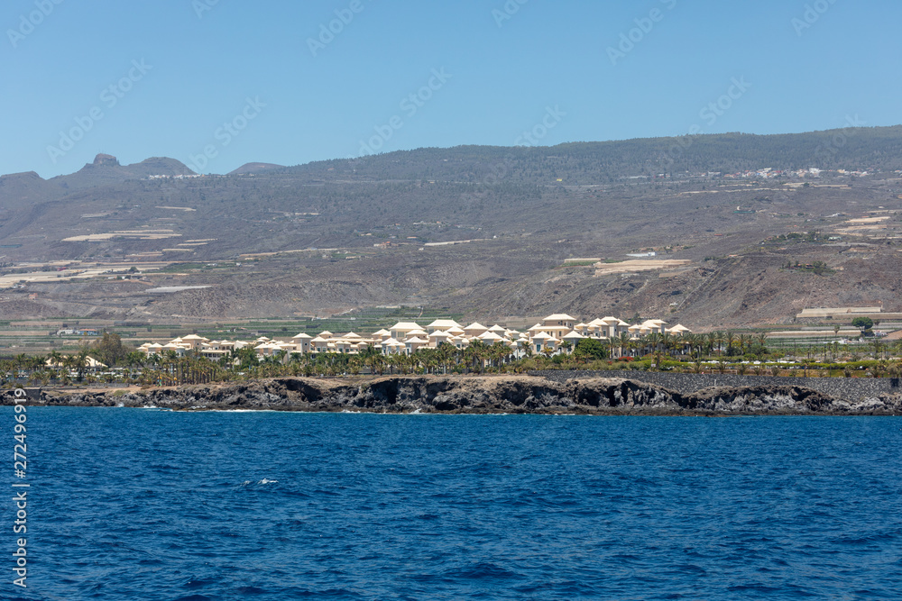 Beautiful rocks at beach with waves and blue water in Teneriffa