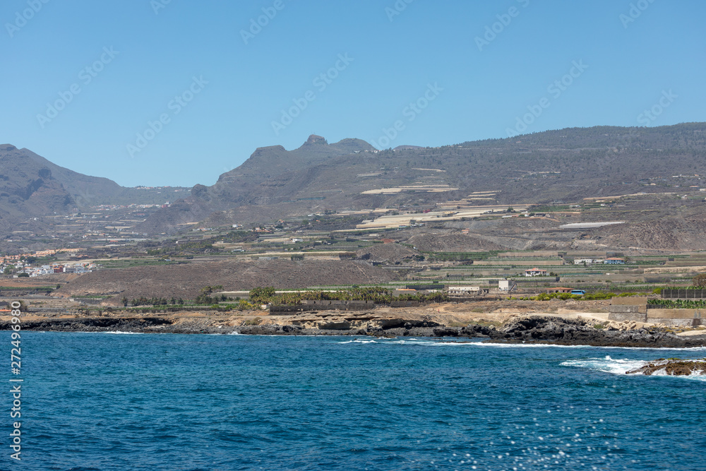 Beautiful rocks at beach with waves and blue water in Teneriffa