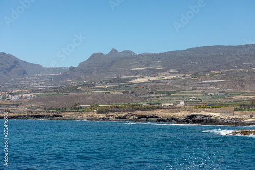Beautiful rocks at beach with waves and blue water in Teneriffa
