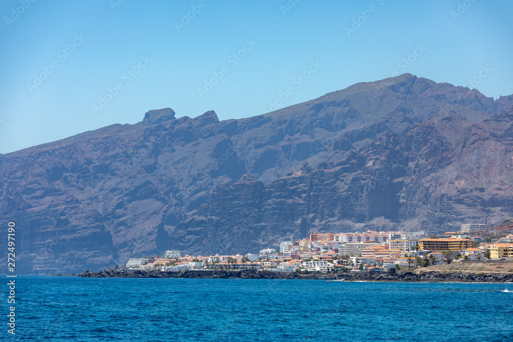 Beautiful rocks at beach with waves and blue water in Teneriffa