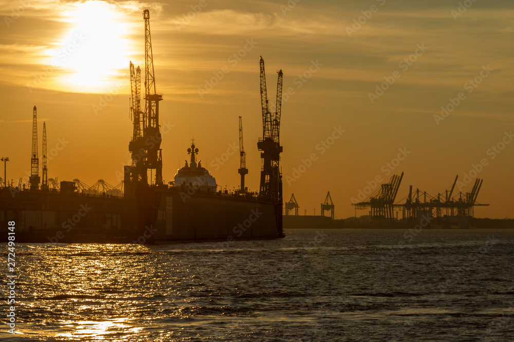 Sunset in the harbour of Hamburg, Germany.