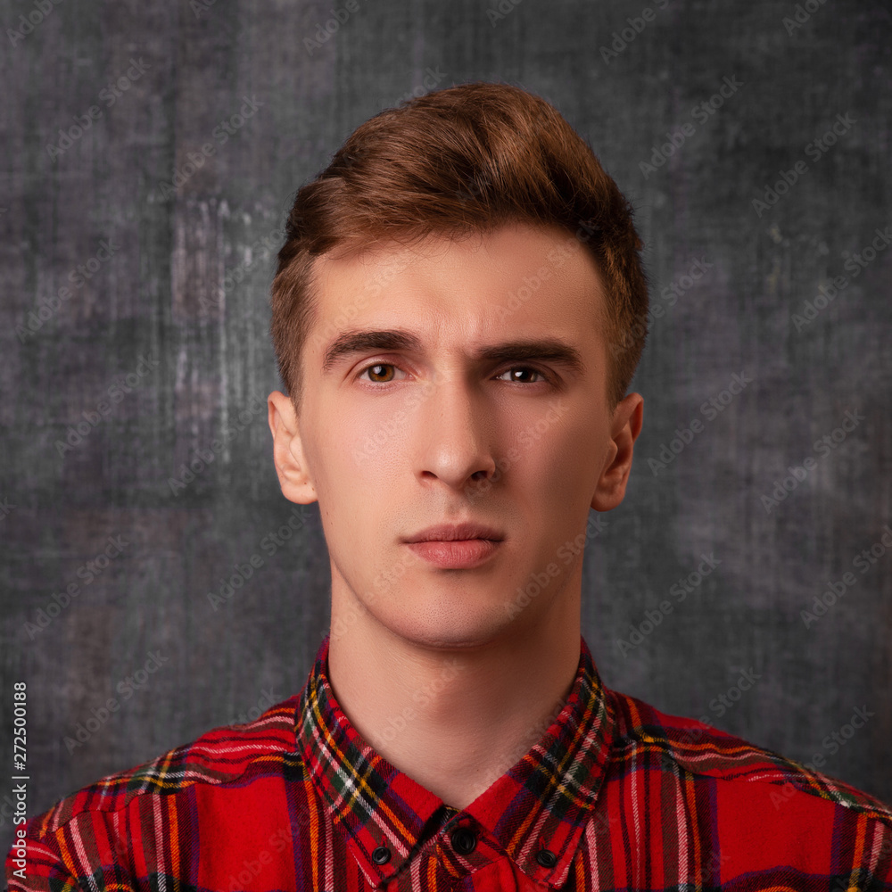 Portrait. Young handsome man gazing left with thoughtful alarming expression. Emotion. Portrait. Young handsome man gazing left with thoughtful alarming expression. Emotion.
