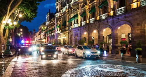 Traffic time lapse of Puebla city centre at night.  Municipal Palace of Historic Centre of Puebla, part of world heritage sites of UNESCO. Puebla, Mexico, in June 2, 2019. photo