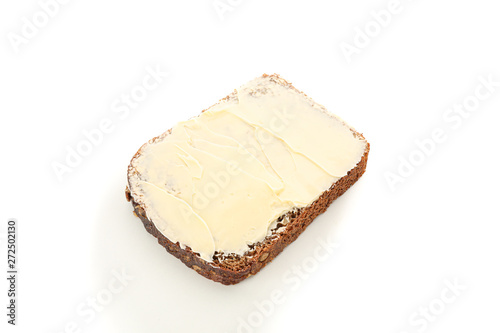 Rye bread piece with butter isolated on white background. Bakery products