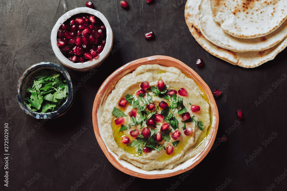 Mutabal, parsley , pomegranate and pita bread Mutabal, parsley , pomegranate and pita bread