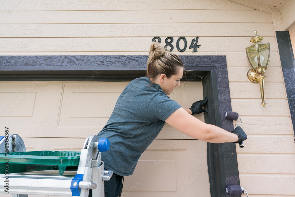 Volunteers Painting a House