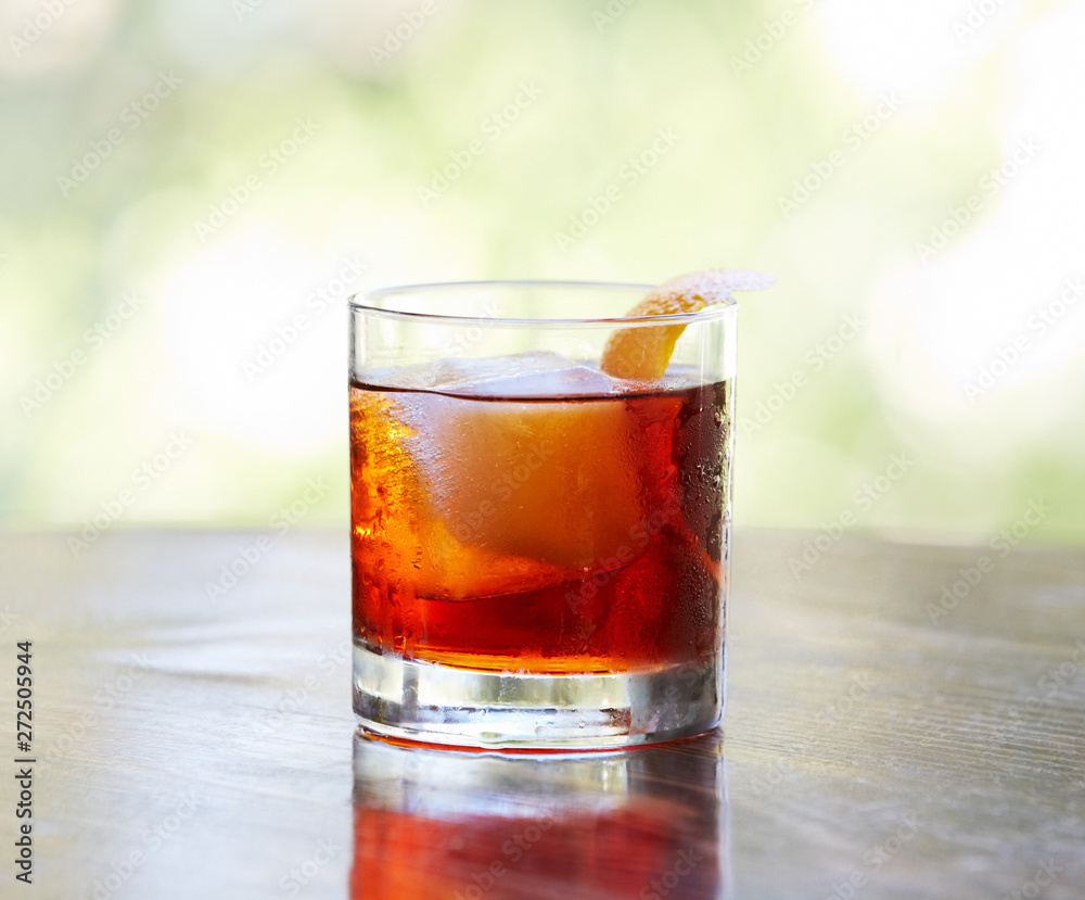 Gin and red vermouth and fresh lemon peel Gin and red vermouth and fresh lemon peel