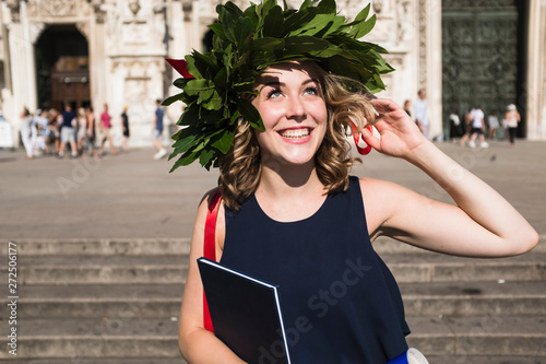 Happy young woman celebrating graduation photo