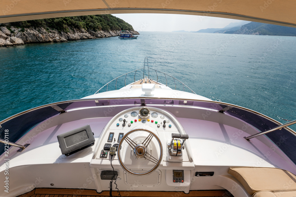 Steering wheel on a luxury yacht cabin