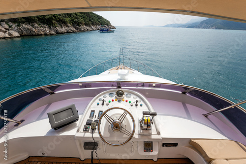Steering wheel on a luxury yacht cabin © BAHADIR YENICERI
