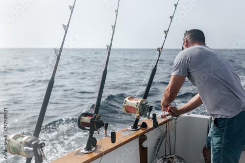 Man working on a fishing boat photo