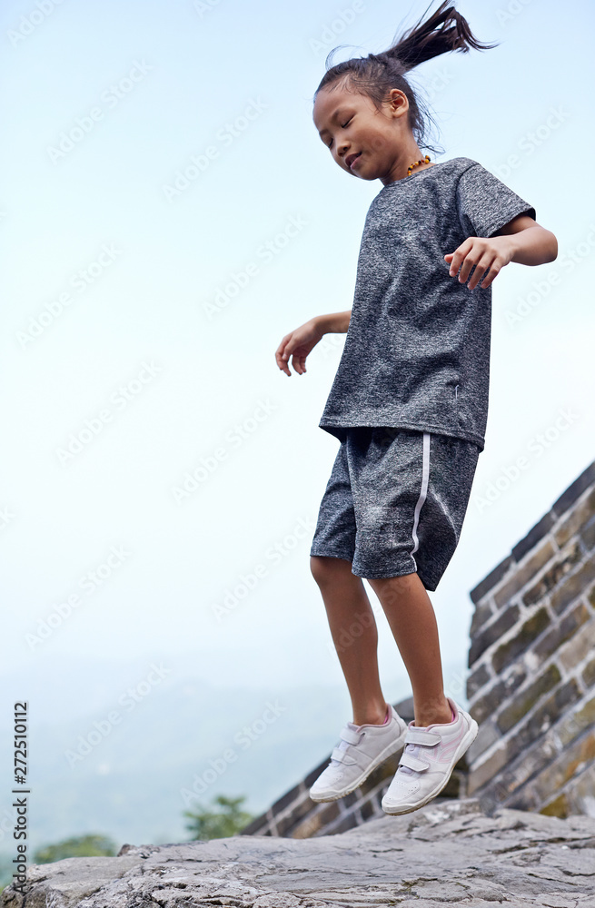 Beautiful Asian little girl climbing the Great Wall Beautiful Asian little girl climbing the Great Wall