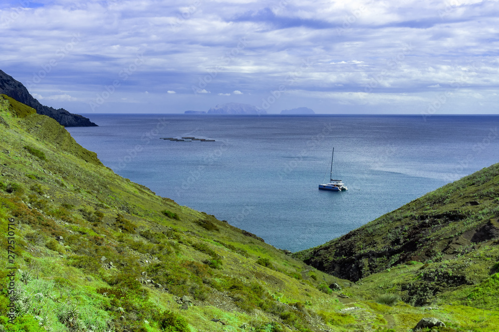 View of the bay and yacht at between cliffs at Ponta de Sao Lourenco, Madeira