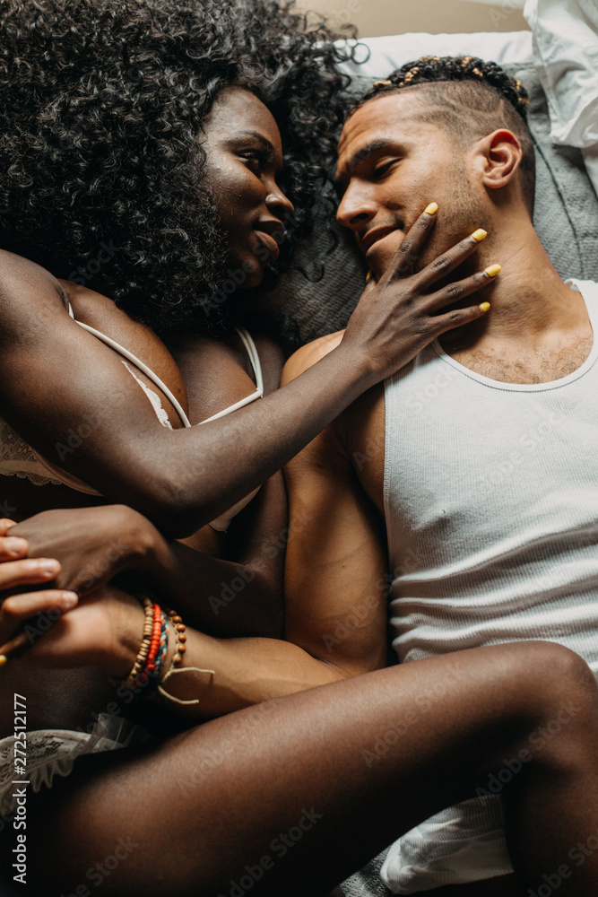 Couple Intertwined in Bed Couple Intertwined in Bed