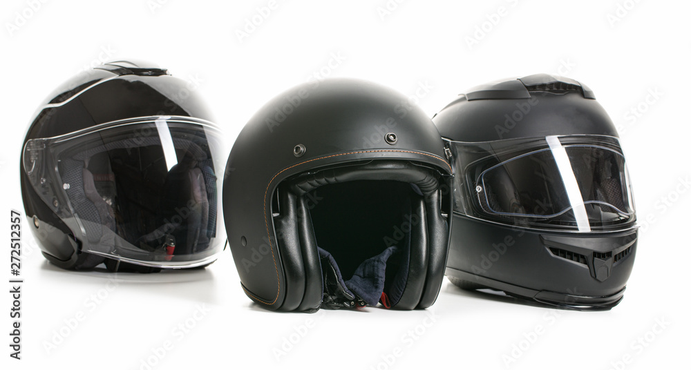 Three black motorcyle helmets.
