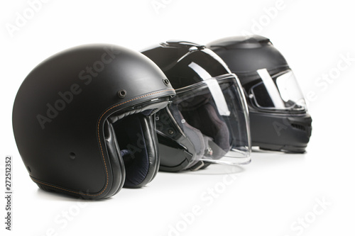 Three black motorcyle helmets. photo