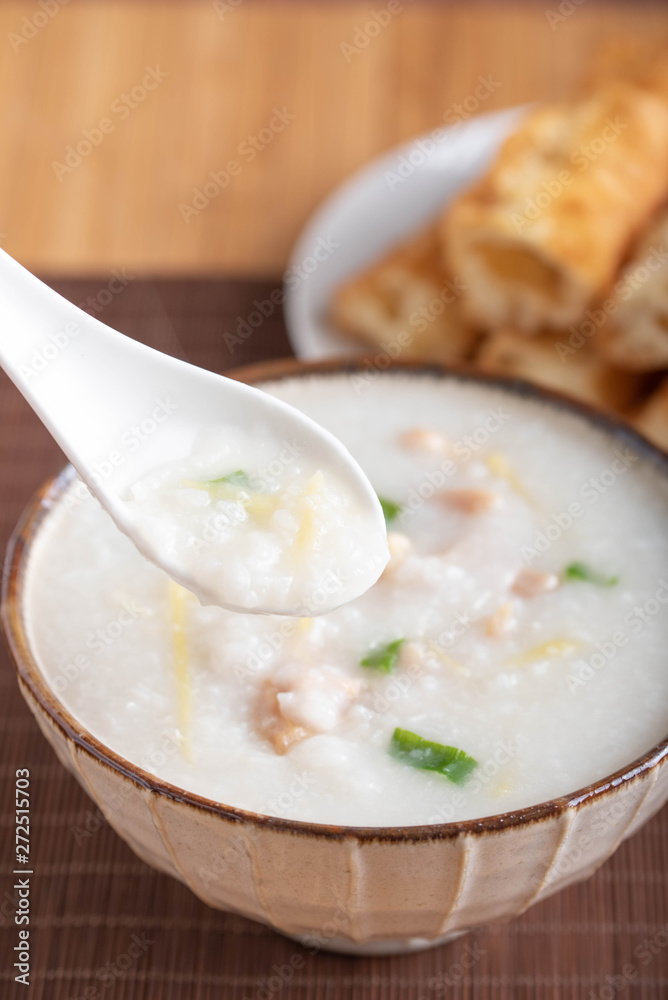 chinese congee on spoon close up image chinese congee on spoon close up image