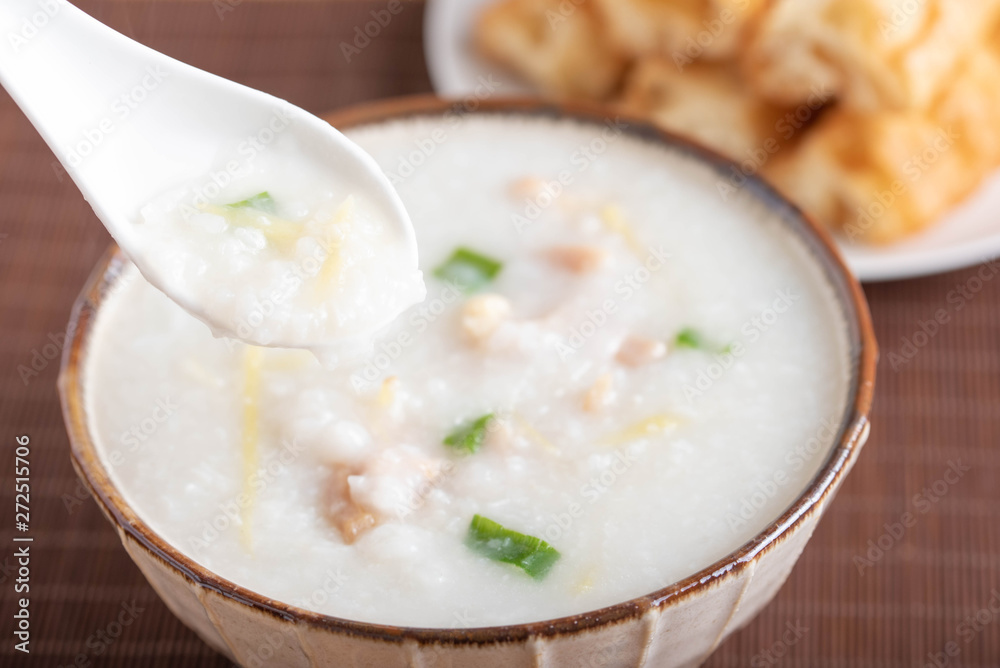 chinese congee on spoon close up image chinese congee on spoon close up image