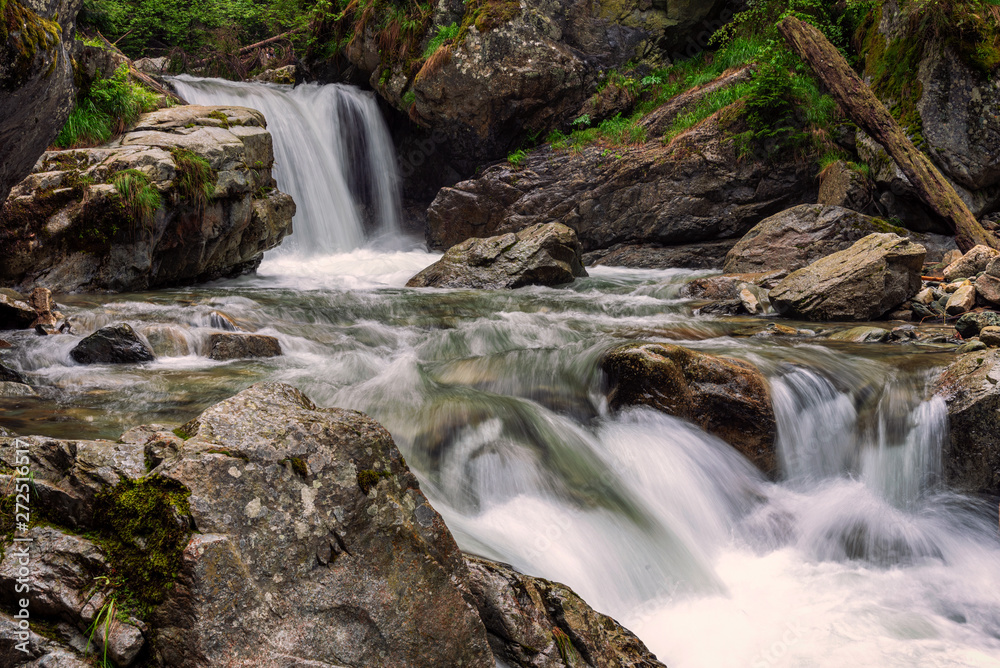 Rapid river and small waterfalls in Carpathian Mountains
