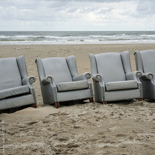 Row of chairs on the beach photo