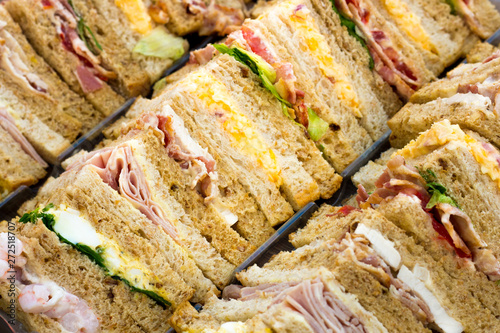 Close up of a select.ion of sandwiches with different fillings on a tray