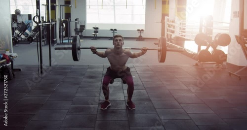 Athlete working in the gym with barbell
