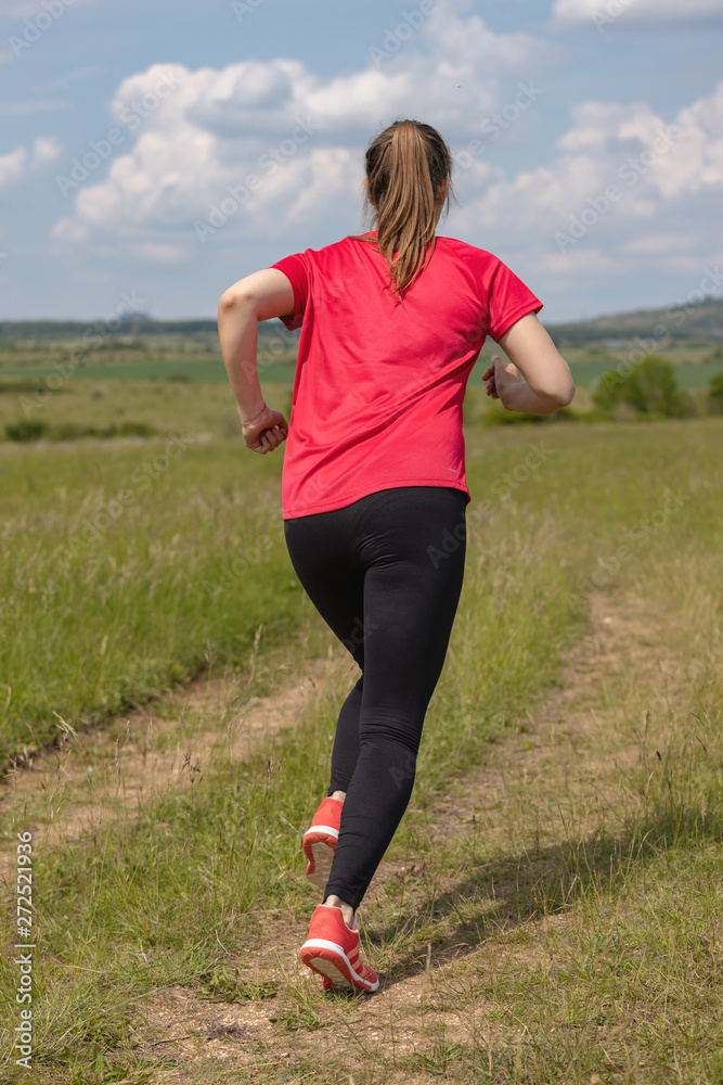 Young pretty girl running on the meadow Young pretty girl running on the meadow
