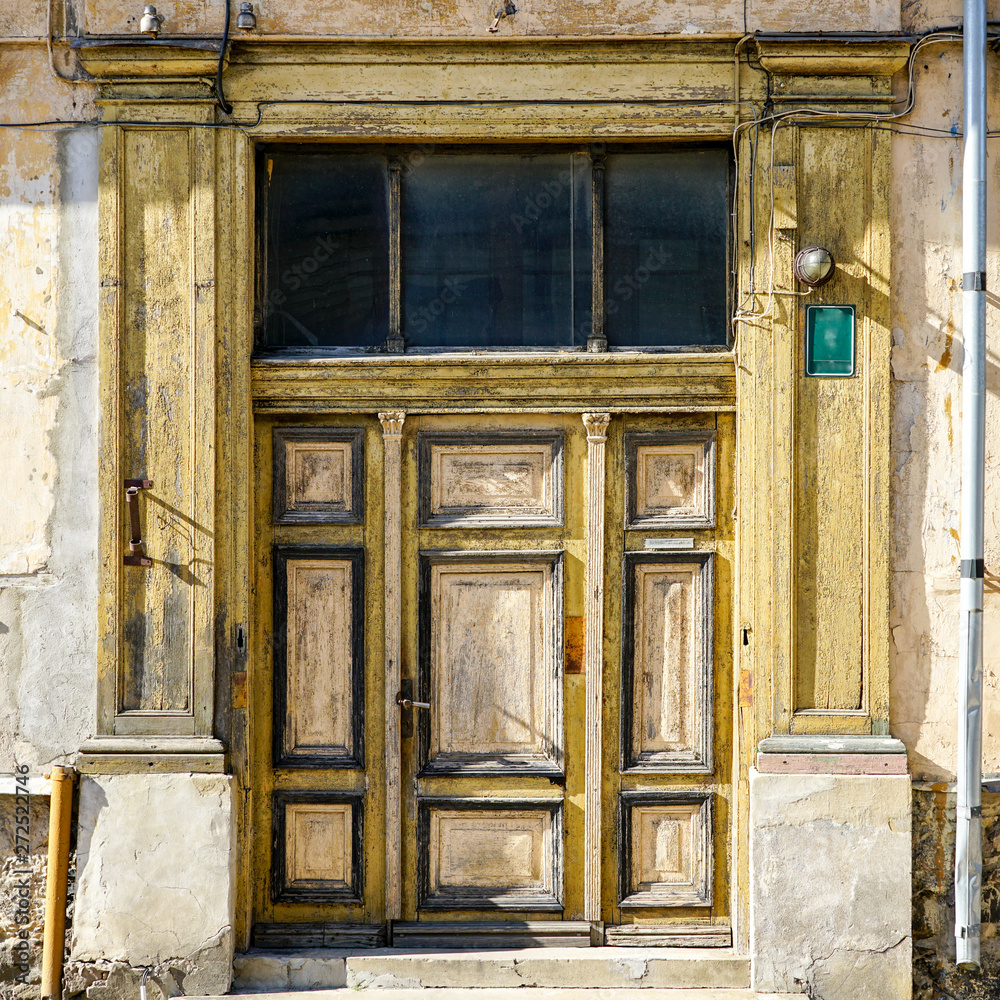 an old interesting three-piece wooden door in Liepaja an old interesting three-piece wooden door in Liepaja