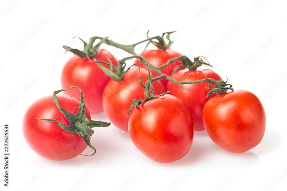 Fresh juicy red cherry tomato bunch closeup isolated on white background.