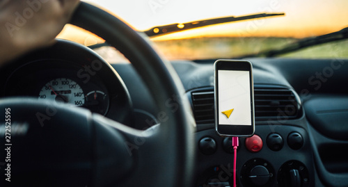 car trip on a sunny day, navigator in the smartphone in the summer © velimir