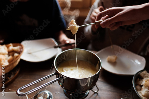 group of teen eating cheese fondue