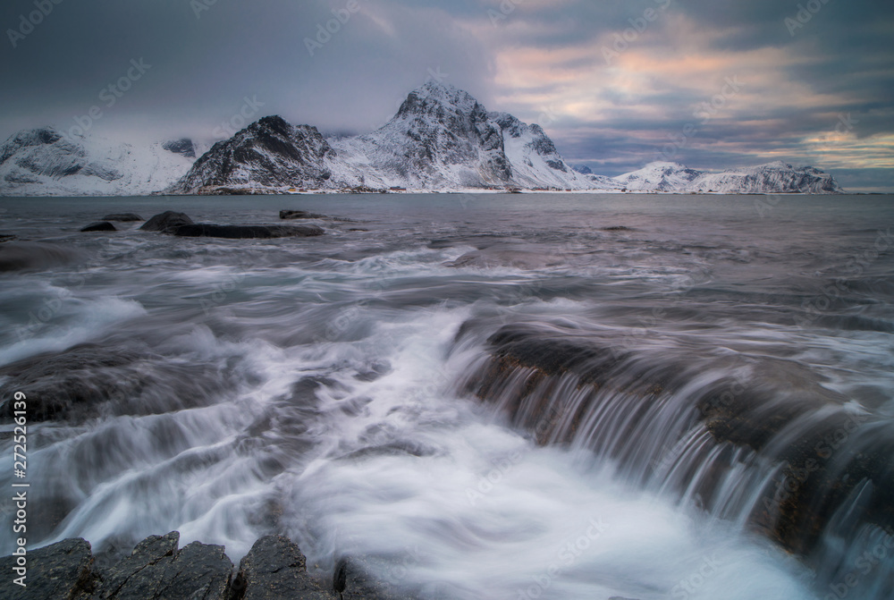 Dark clouds over a fjord near Vareid on the Lofoten in northern Norway on a cold day in winter Dark clouds over a fjord near Vareid on the Lofoten in northern Norway on a cold day in winter