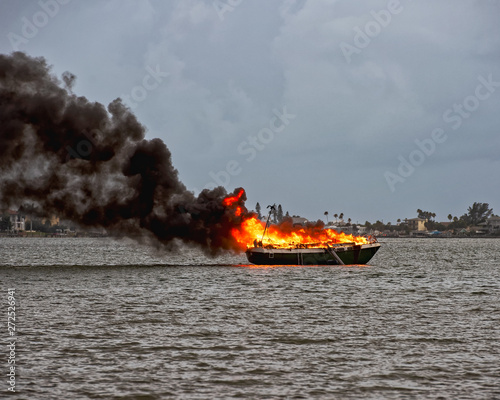 Sailboat engulfed in flames