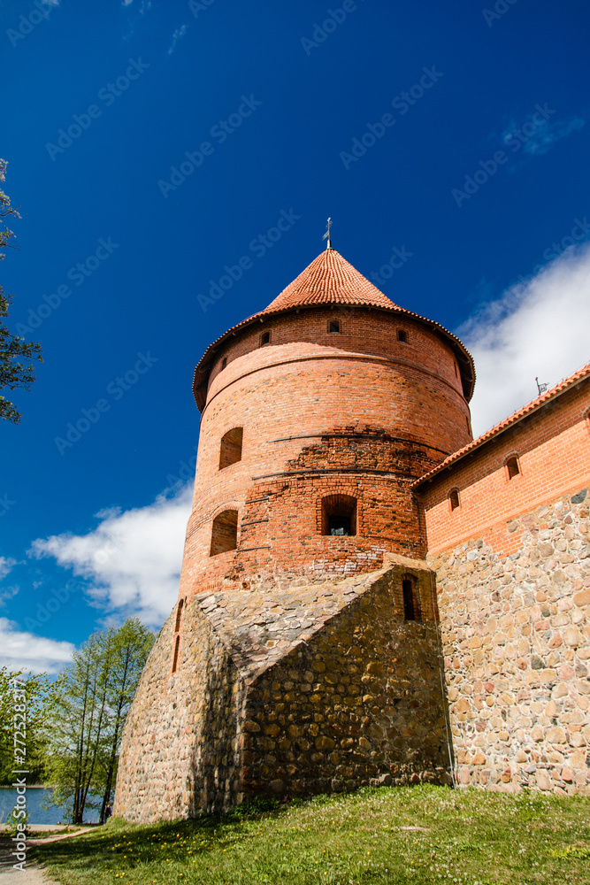 Trakai Island Castle in Lithuania, Eastern Europe. Tourists visit city castle. Famous ancient landmark