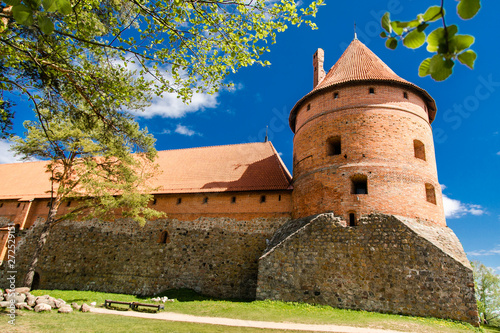 Trakai Island Castle in Lithuania, Eastern Europe. Tourists visit city castle. Famous ancient landmark
