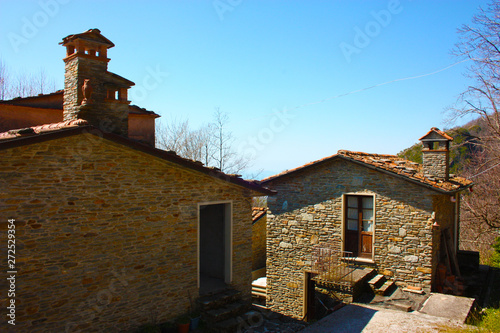 houses built and under construction. stone and stone houses, in perfect vintage style photo