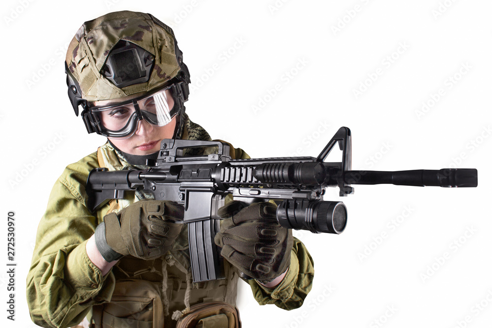 Beautiful fully equipped military soldier woman aiming at the enemy with automatic rifle M16, isolated photo. Beautiful fully equipped military soldier woman aiming at the enemy with automatic rifle M16, isolated photo.