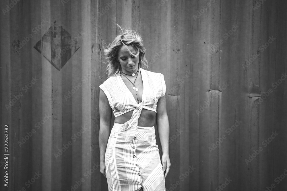 Fototapeta premium Blonde Model Showing Midriff in a Croptop 