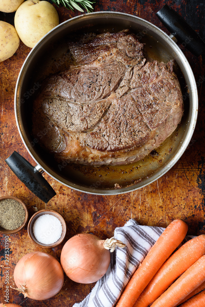 Chuck Roast browned before being cooked in a slow cooker Stock Photo Adobe Stock