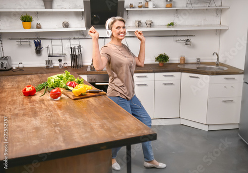 Mature woman dancing while ...